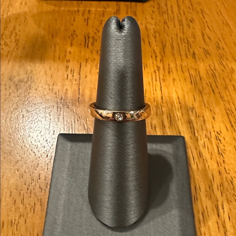 Elegant Goldtone Band with Faux Diamond Accent.